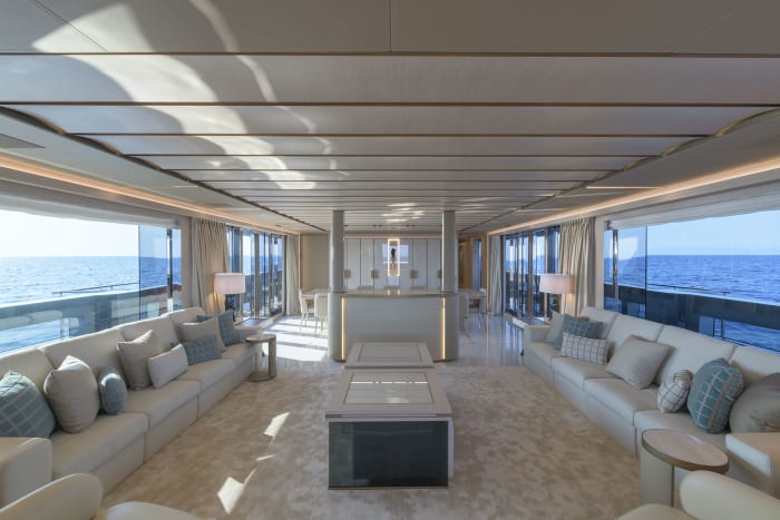 The yacht’s contemporary décor is based on the bright and natural nuances of wood and off-white textiles combined with more opulent onyx, leather and bronzed metallic accents.