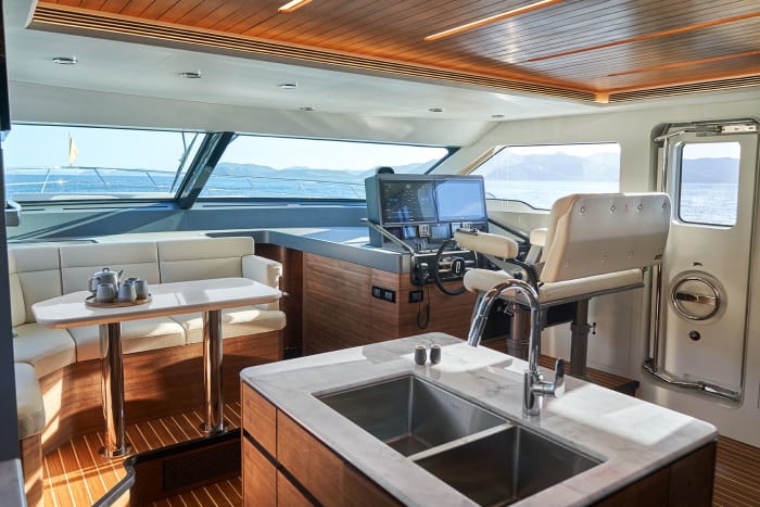 A breakfast nook forward of the galley benefits from excellent natural light. 