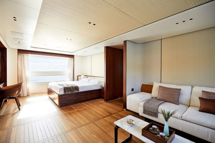 The owner’s suite continues the design theme of natural light, wide-angle views and wood soles. 
