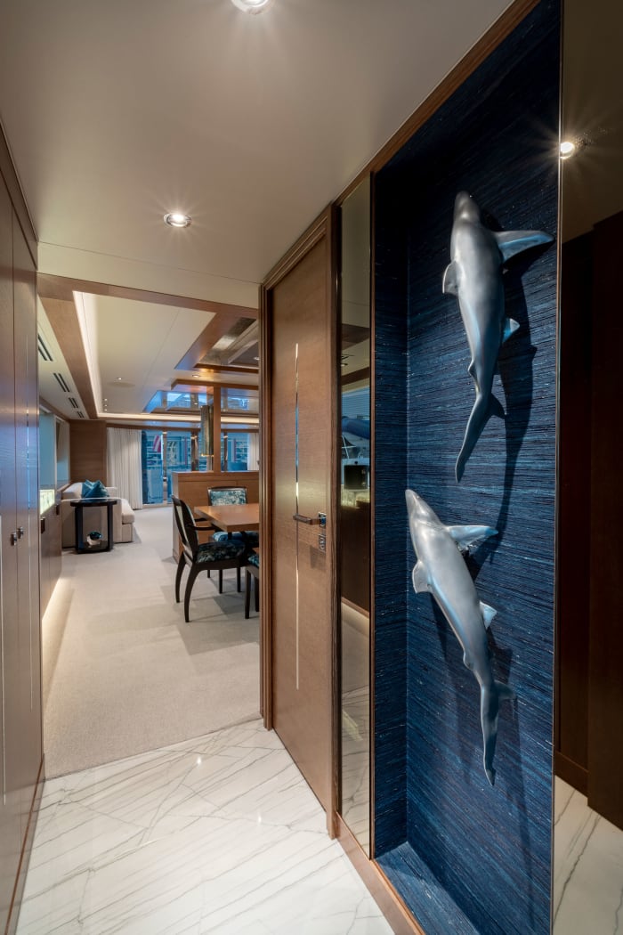 A pair of life-size reef sharks adorn the hallway.