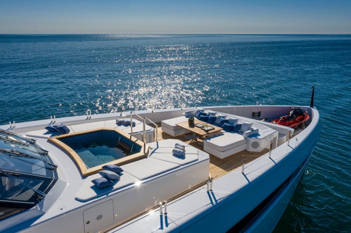 The foredeck is equipped with a hot tub, sun loungers and an alfresco dining option.
