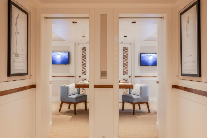 Symmetrical staterooms have space-saving cantilevered pull-down desks.