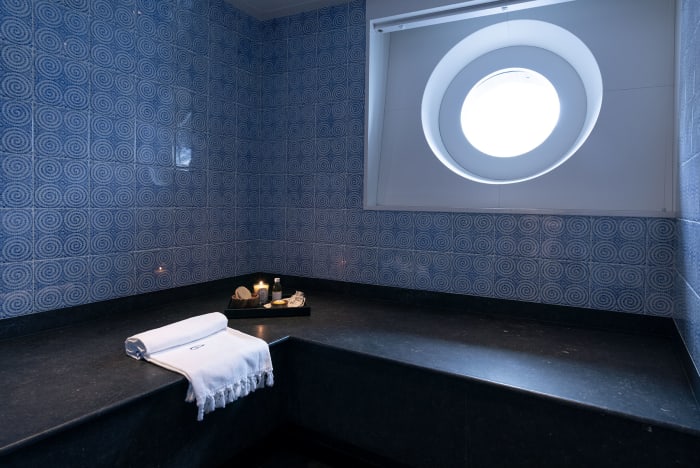 The spa includes a blue-tiled hammam.