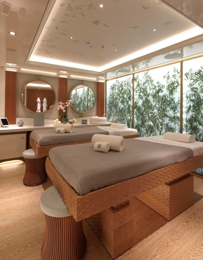 The massage room is enhanced by a bamboo forest wall. 