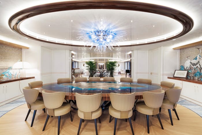 The boardroom on the main deck has a custom conference table with an antique map of Jamaica engraved in bronze and embedded in deep blue resin.   