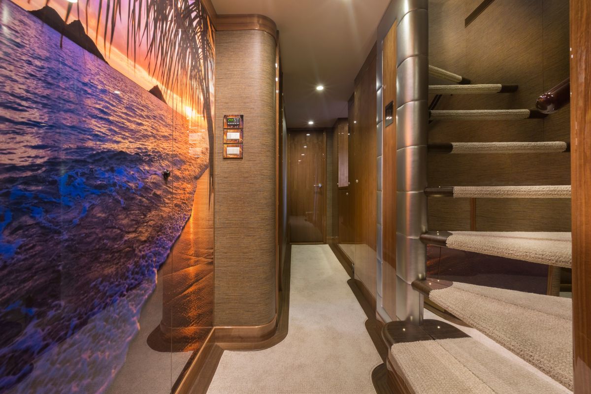 A custom-made piece of art adorning the belowdeck foyer wall is reminiscient of a place where the owner loves to cruise.