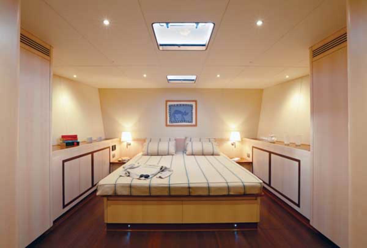 The master suite with its king-size bed is in the forepart of the yacht.