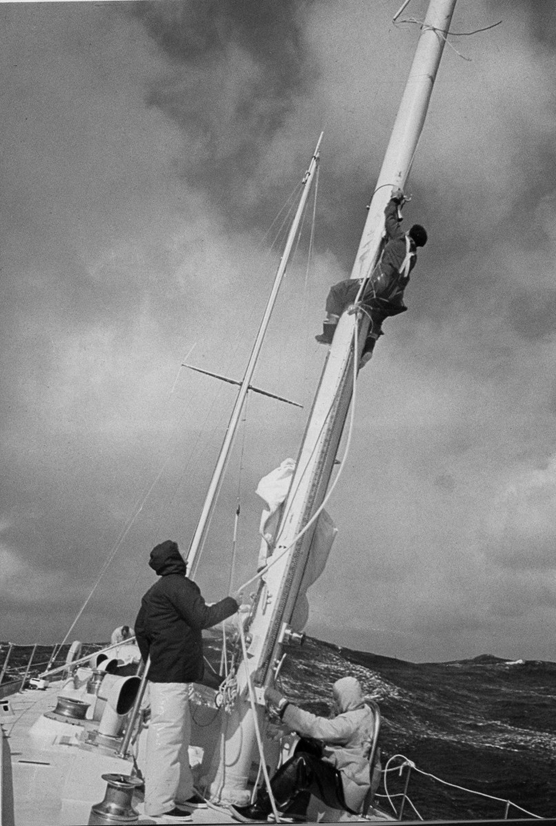 Sven aloft, securing an anchor point for a jury-rigged temporary headsail