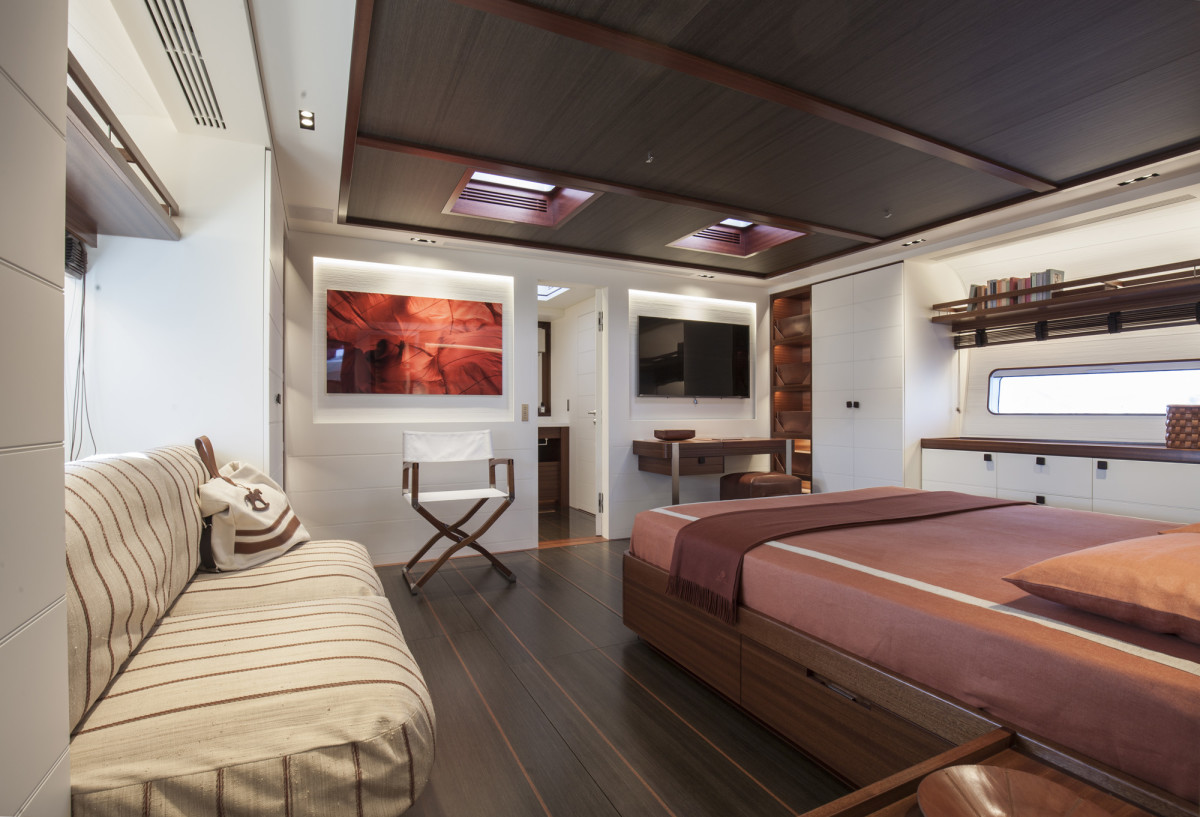 Tones of white and mahogany accentuate the master stateroom.