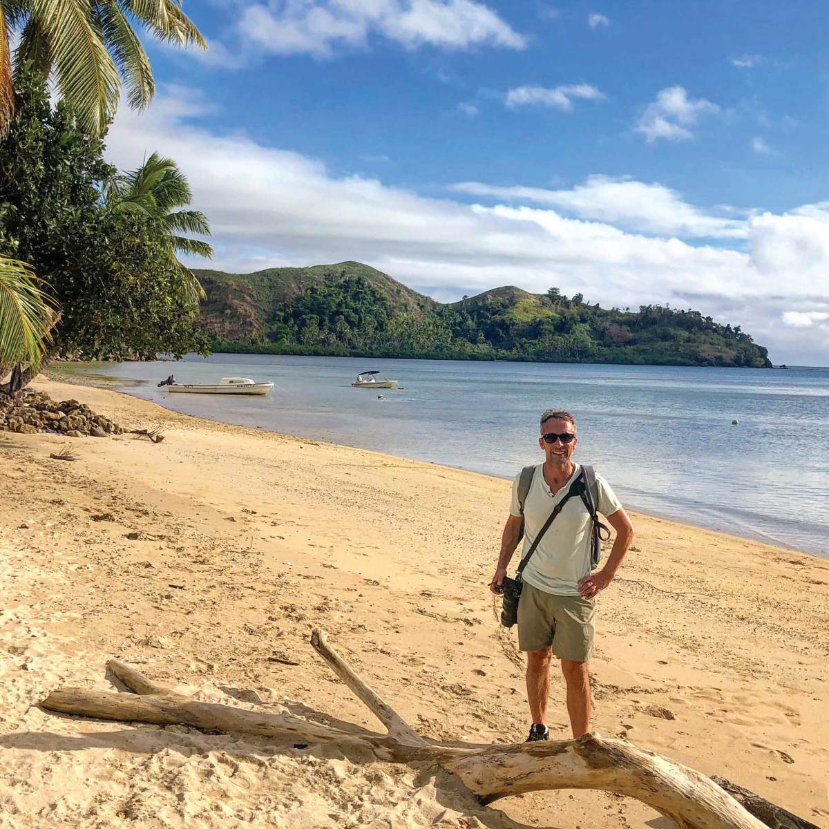 With camera in hand, the owner enjoys a land excursion on Vanua Balavu, Fiji, on a recent voyage aboard Dream. 