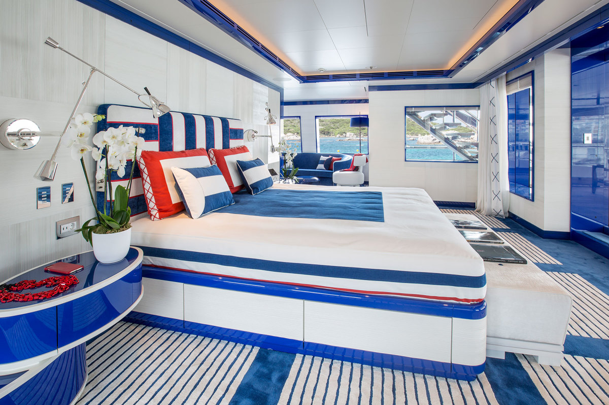 The master stateroom and its adjacent lounge are accessorized with the owner’s favorite color, blue. 

