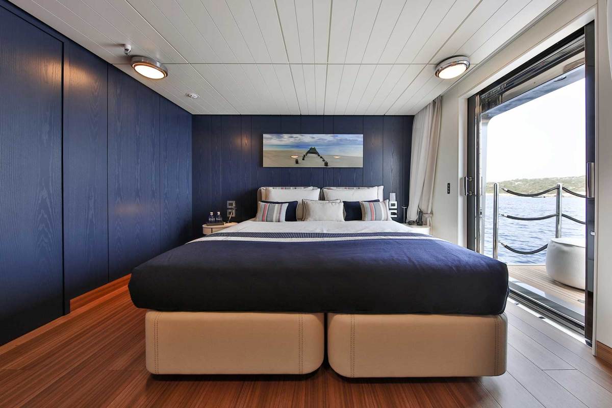 One of two lower-deck guest staterooms with a private balcony that folds out from the hull.