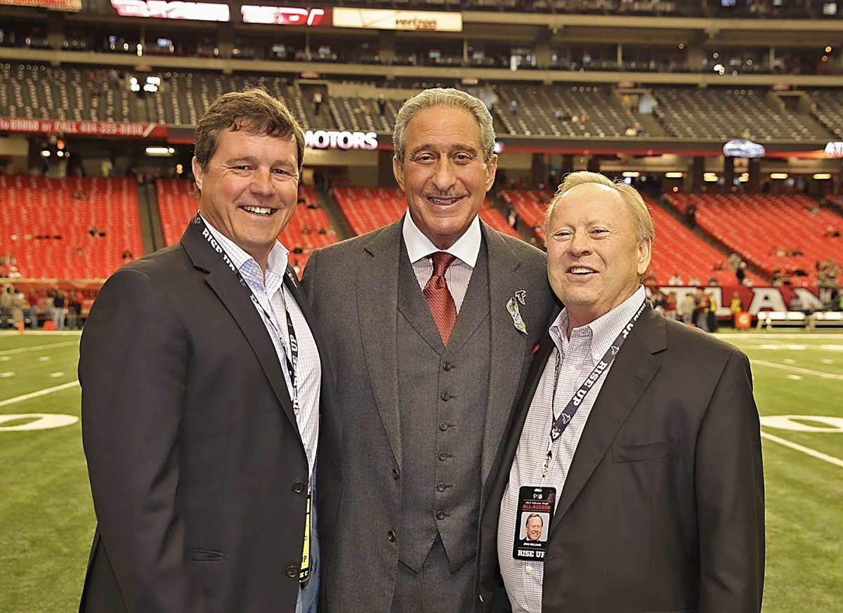 Arthur Blank 
is flanked by Dan Jackson, his representative during the build at Oceanco, and his close friend and yachting buddy John Williams (now deceased).