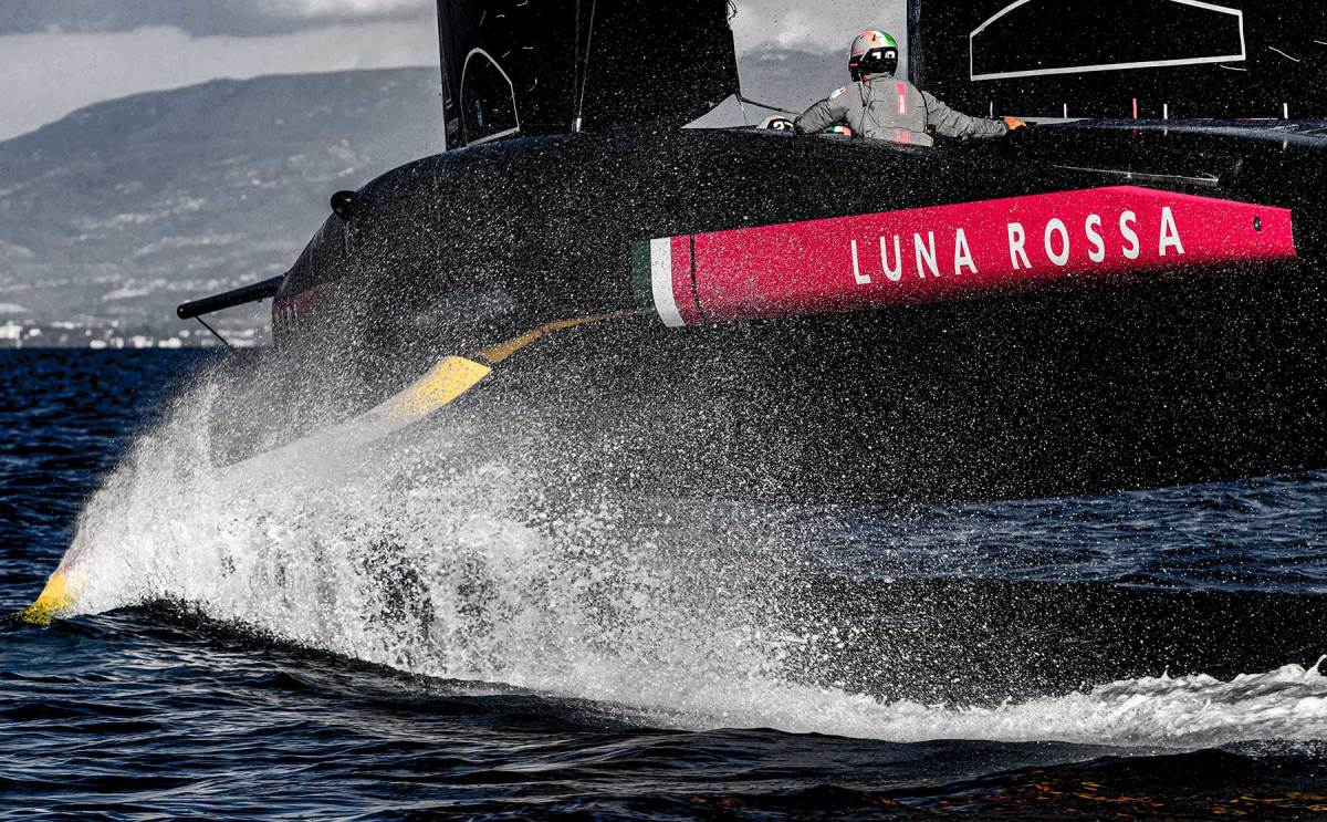 Luna Rossa training on its first-generation boat. Its skifflike hull features a bustle in the center of its underneath sections, to help it lift quickly onto its foils.