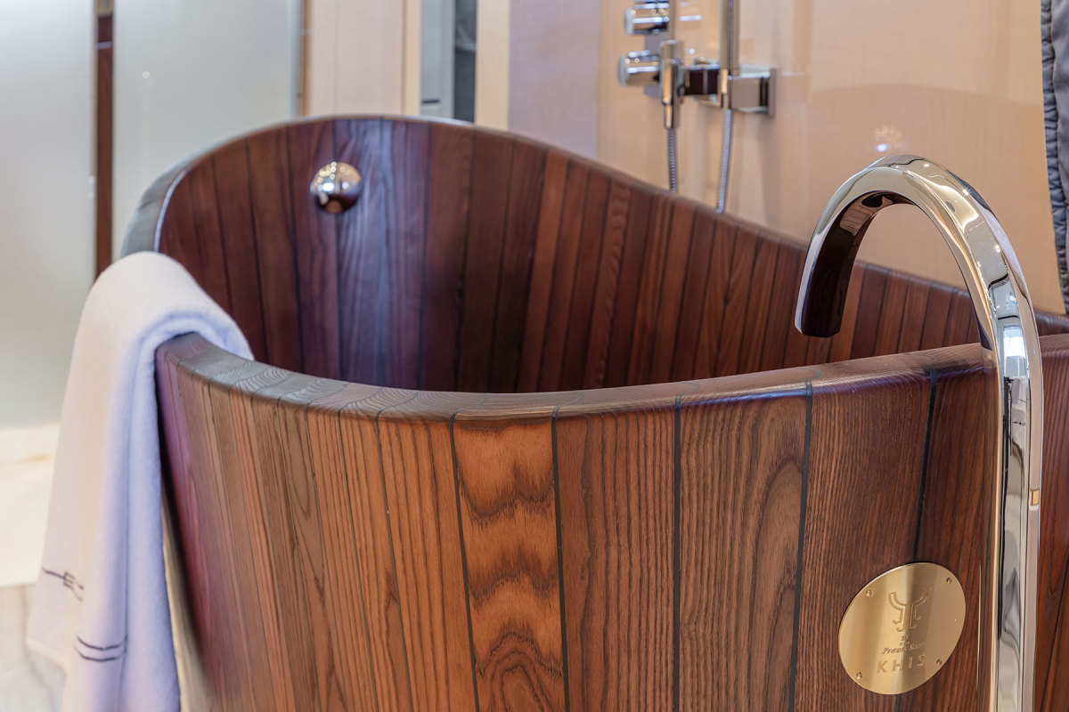 The owner’s bathroom has a bespoke wood bathtub handcrafted out of white ash by Khis in Estonia. 